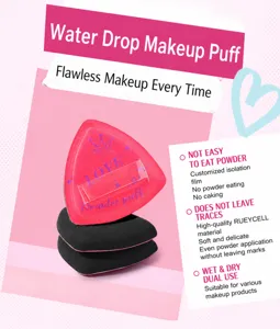 Close-up of soft triangular Rubycell powder puffs in red and black for makeup application