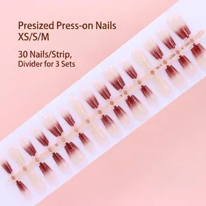 Detailed macro view of 30pcs gradient wine red and nude press-on nails on a plastic strip