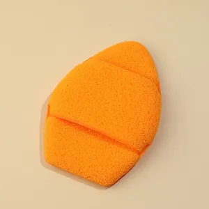 Close-up of XXL thickened orange exfoliating facial cleansing sponge glove