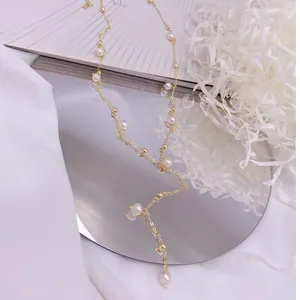 Detailed close-up of elegant Y-shaped tassel necklace featuring natural freshwater pearls