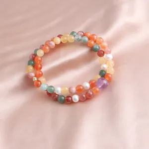 Detailed view of a vibrant multi-colored double-layer beaded jade and crystal bracelet