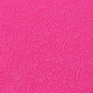 Detailed macro view of a pink silicone fondant mold featuring rose lace patterns