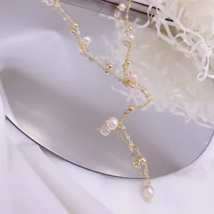 Detail of French natural freshwater pearl Y-shaped tassel necklace with gold chain