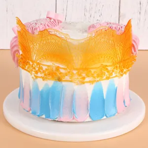 Detailed macro shot of orange edible fondant lace border used for DIY cake decoration