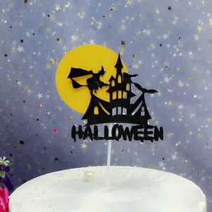 Close-up detail of Halloween witch and haunted castle cake topper for party decoration