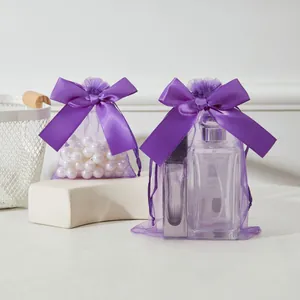 Deux sacs cadeaux en organza violet avec cordons et nœuds en satin pour bijoux ou parfum