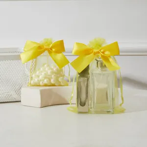 Pochette bijoux en organza jaune avec nœud en satin et cordon pour petits cadeaux