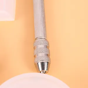 Close-up detail of a professional silver metal hand drill tool for resin jewelry DIY crafts