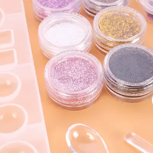 Macro detail of colorful decorative glitters and silicone mold for resin jewelry DIY