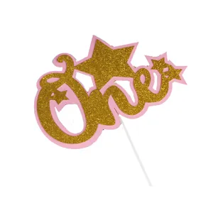 Gold glitter 'one' cake topper with pink backing for first birthday party decoration