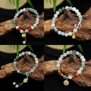 Detailed display of four gemstone bead bracelets on natural wood background