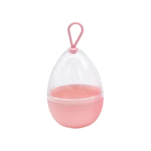 Roze eivormige beauty blender opbergdoos met siliconen haak voor reizen en organisatie.