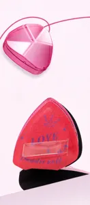 Detail of pink triangular makeup sponge with multifaceted clear storage case