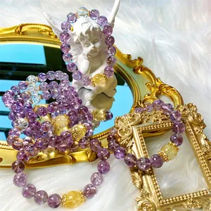 Detailed view of natural purple crystal bracelets with sparkling internal fragments.