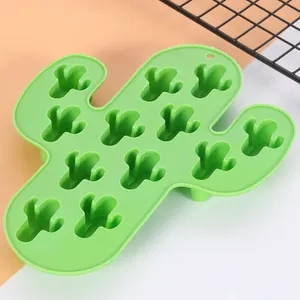 Close-up detail of a green cactus-shaped silicone ice cube tray with 12 small cavities.