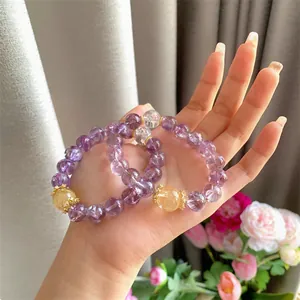 Close-up of natural purple amethyst crystal bracelet with shimmering ice-cracked effect