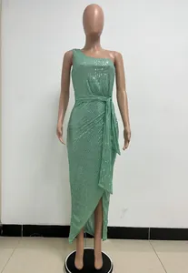 Detailed view of a mint green one-shoulder sequined evening dress on a mannequin