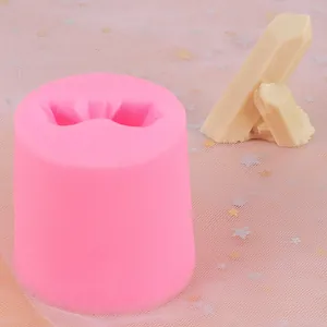 Detail view of pink silicone mold with finished cream-colored crystal iceberg shapes