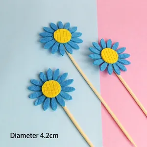 Detailed view of non-woven fabric blue sunflower cake toppers with a diameter of 4.2cm
