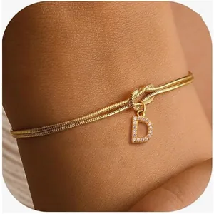 Gold-plated snake chain knot bracelet with a sparkling crystal letter D pendant charm