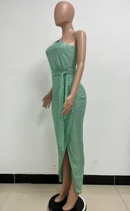 Side view of a stunning mint green one-shoulder sequin maxi dress with elegant pleats