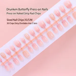 Detailed view of pink gradient press-on nails with glitter and gold accents 30pcs