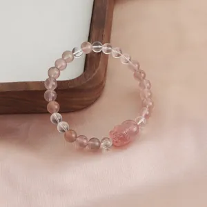 Premium natural strawberry quartz bracelet with a carved Pixiu and clear crystal beads