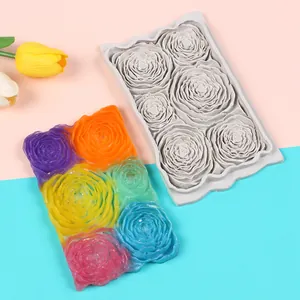 Detailed view of 3D rose flower fondant silicone mold with colorful finished craft