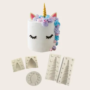 Silicone mold set for unicorn cake toppers featuring ears, eyes, and horn details
