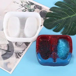 Detailed macro view of leaf-shaped silicone mold with finished red and blue resin casting
