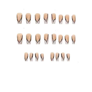 Detail view of 24 pieces press-on nails with black V-lines and silver glitter decor