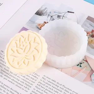 Close-up of silicone lotus mold and embossed mooncake sample for DIY crafts.
