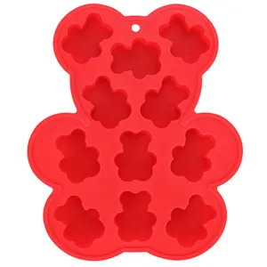 Detail shot of the red bear-shaped silicone mold featuring multiple small bear cavities