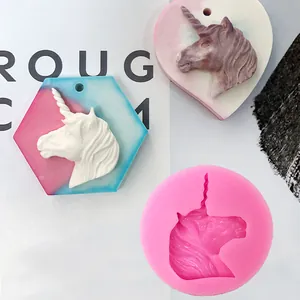 Detail view of unicorn silicone mold with finished resin heart and hexagon casts