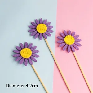 Detailed view of purple non-woven sunflower cake toppers with 4.2cm diameter floral head