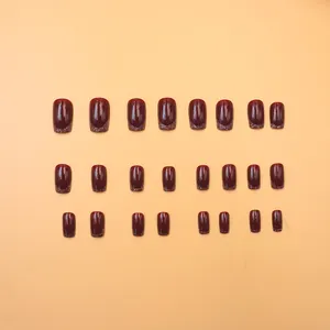 Macro view of 24pcs dark cherry red press-on nails with fine glitter tips on the edges