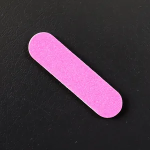 Mini pink nail file buffer for professional manicure and fake nail application