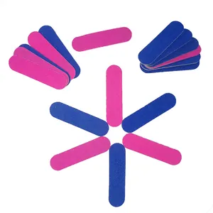 Detailed view of mini double-sided pink and blue nail files with coarse sand grit