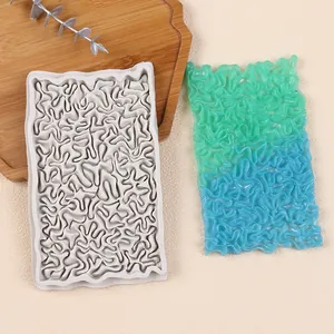 Detailed view of the silicone fondant lace mold and gradient color lace result