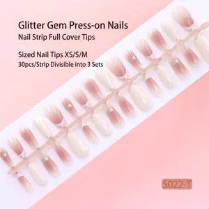 Detailed macro view of 30-piece gradient press-on nail strip in soft pink tones