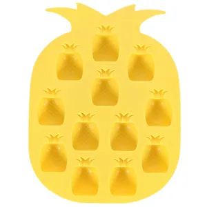 Close-up top view of a yellow pineapple shaped silicone ice cube tray with 12 cavities