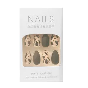 Detail view of 24pcs leopard print and black press-on nails in white packaging