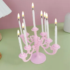 Pink vintage plastic candelabra with 9 white spiral candles for birthday party decor