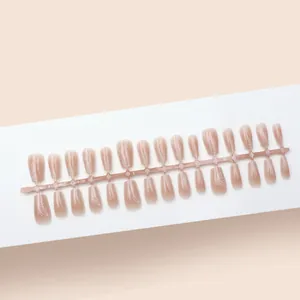 Detailed view of nude gradient cat-eye press-on nails featuring white butterfly line art.