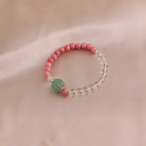 Nahaufnahme Naturkristall-Armband mit rosa Rhodochrosit und grüner Achat-Kürbisperle