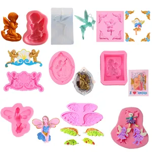 Detail view of various angel and wing shaped silicone molds for fondant and baking.