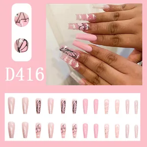 Detailed macro views of long pink press-on nails with butterfly and cherry art designs