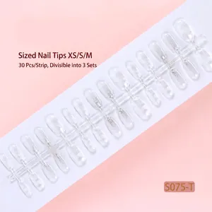 Detail view of 30-piece strip of transparent ice flower press-on nails with glitter