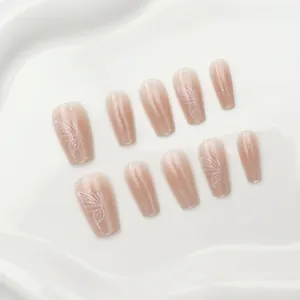 Elegant nude gradient cat eye press-on nails featuring delicate white butterfly line art