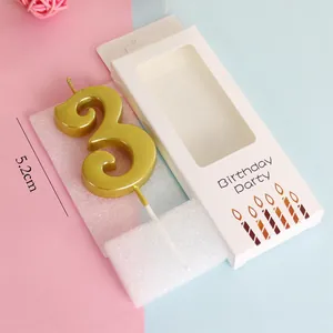 Detailed view of a gold number 3 birthday candle with 5.2cm height and packaging